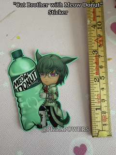 A green-haired chibi with cat ears and glasses hugging a green Meow Donut bottle, next to a ruler