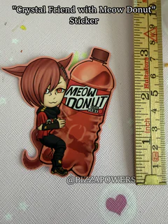 A red-haired chibi with cat ears leaning on a red Meow Donut bottle, next to a ruler